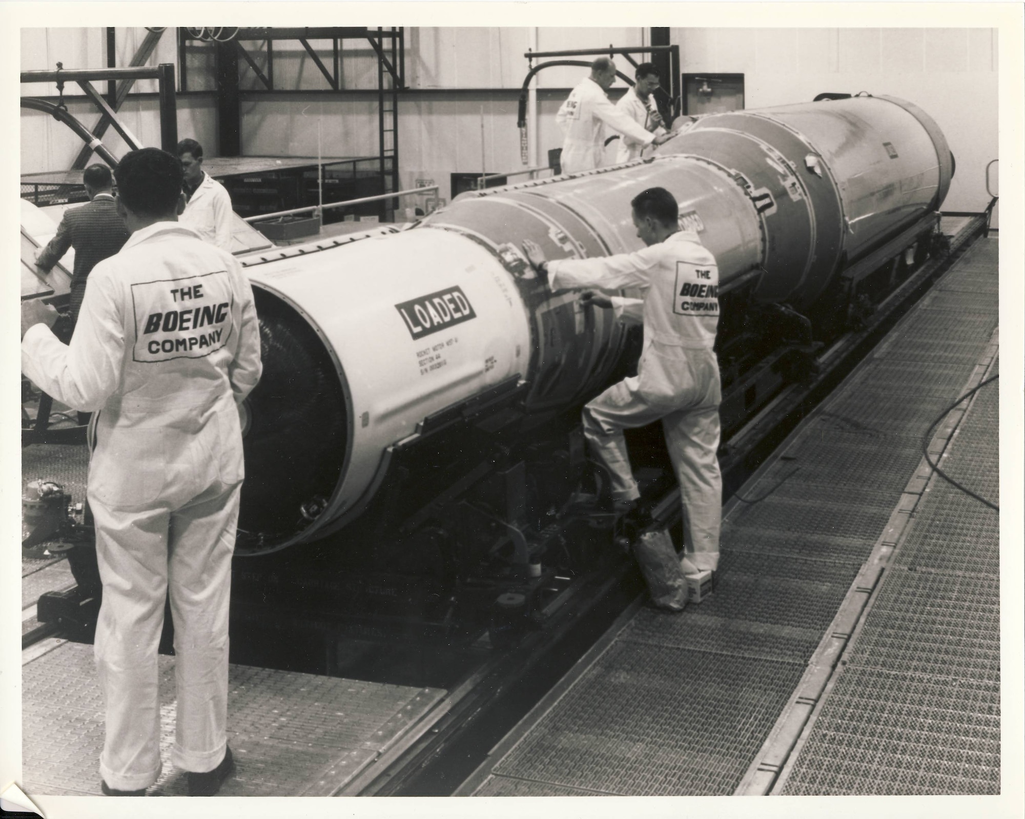 Boeing Company contractors assembling a missile.