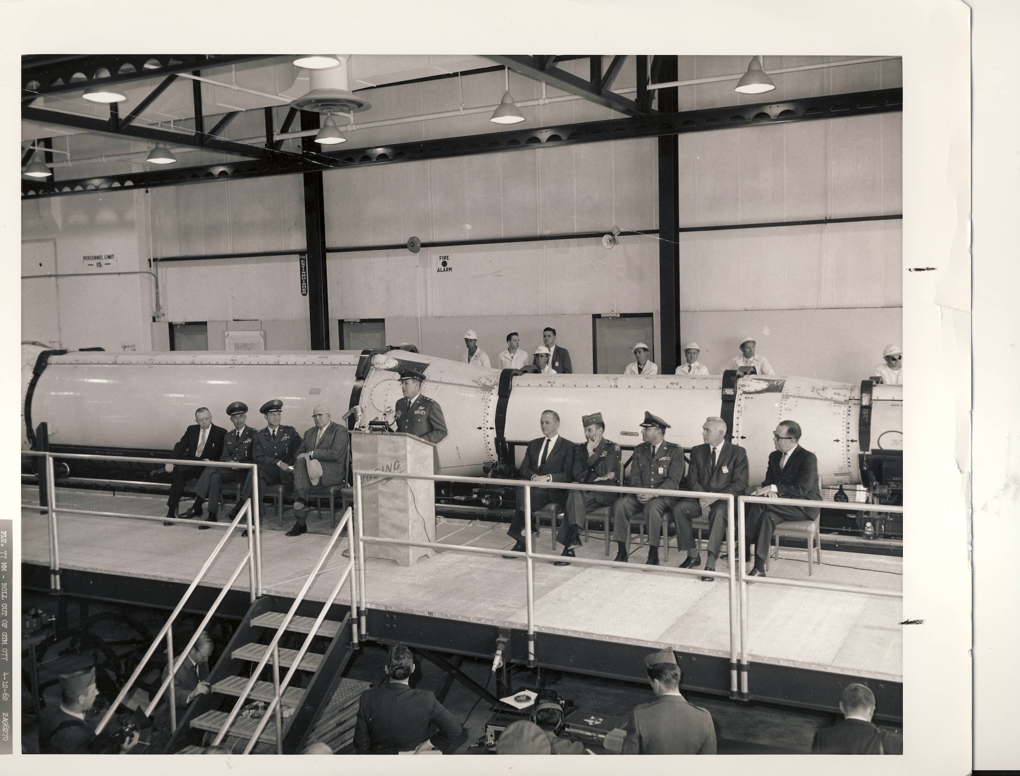 Military and civilian personnel attending a ceremony of the first production Minuteman missile roll out.