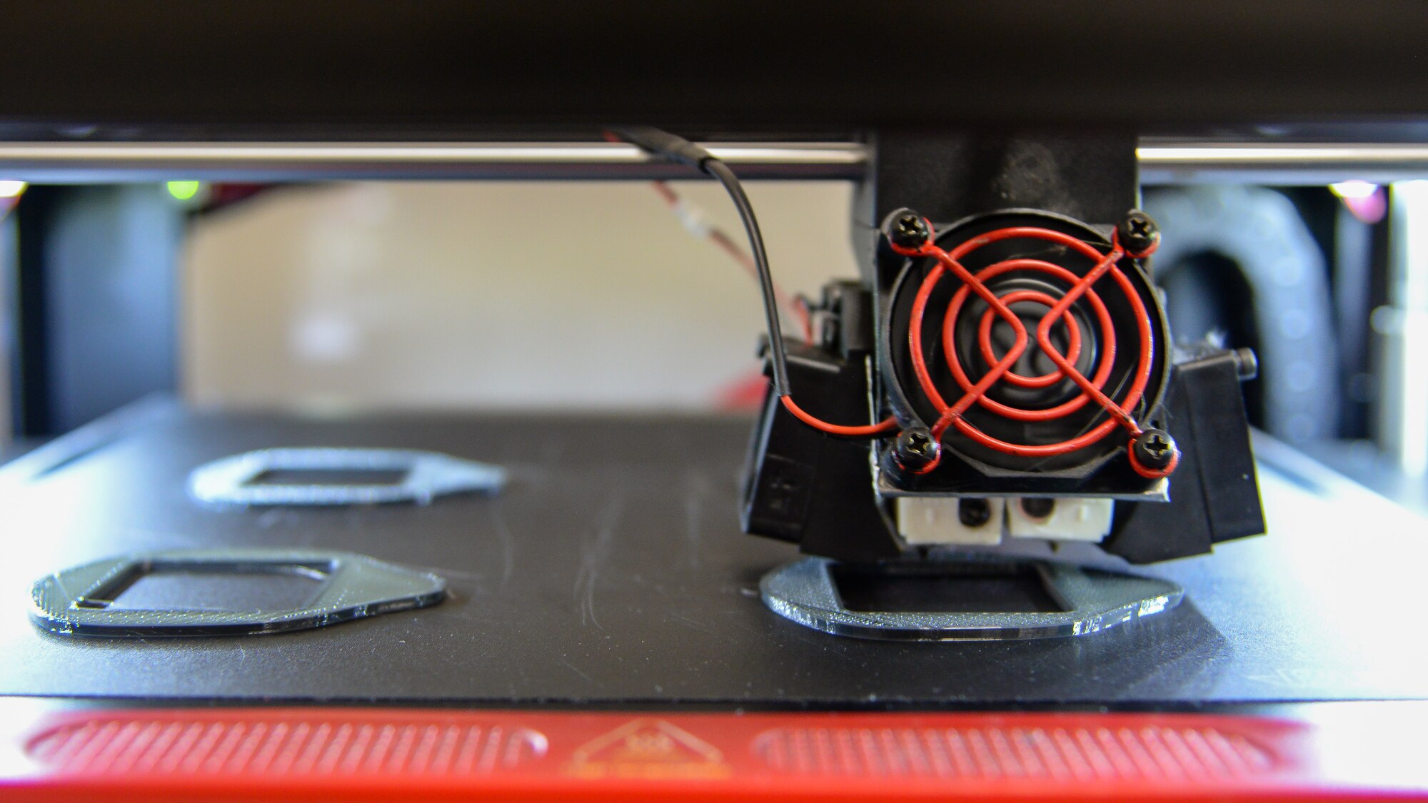 A photo of a 3D printer manufacturing N-95 face masks.