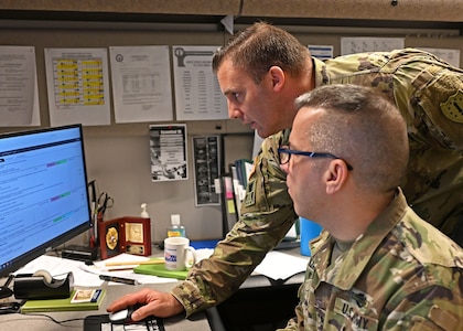 Master Sgt. Robert Valarese and Sgt. 1st Class Dennis Galimberti, NHARNG, monitor current and potential COVID-19 missions from the Joint Operations Center in Concord, N.H.