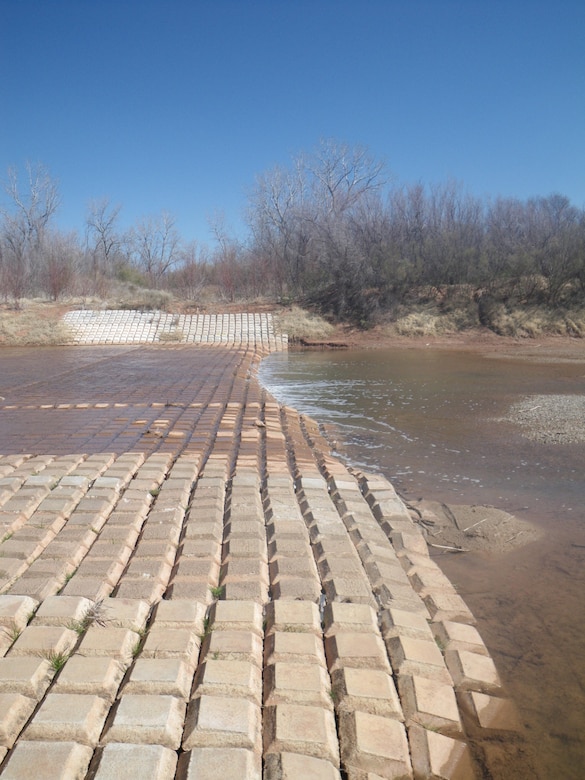 Picture of articulated concrete revetment matting taken during low flow conditions in February 2013 on the Brazos River illustrating likely barrier to fish passage