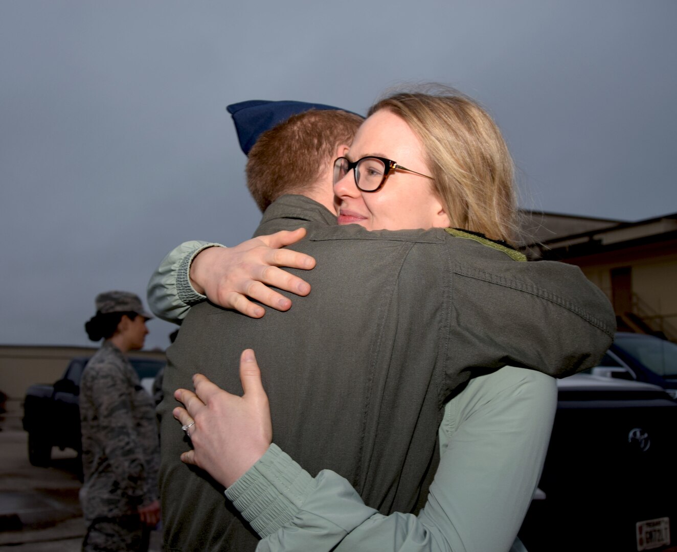 Staff Sgt. Geoffrey Brunelle, 433rd Airlift Wing medical technician, hugs his wife goodbye before departing Joint Base San Antonio-Lackland, Texas, to respond to the COVID-19 crisis April 5, 2020.