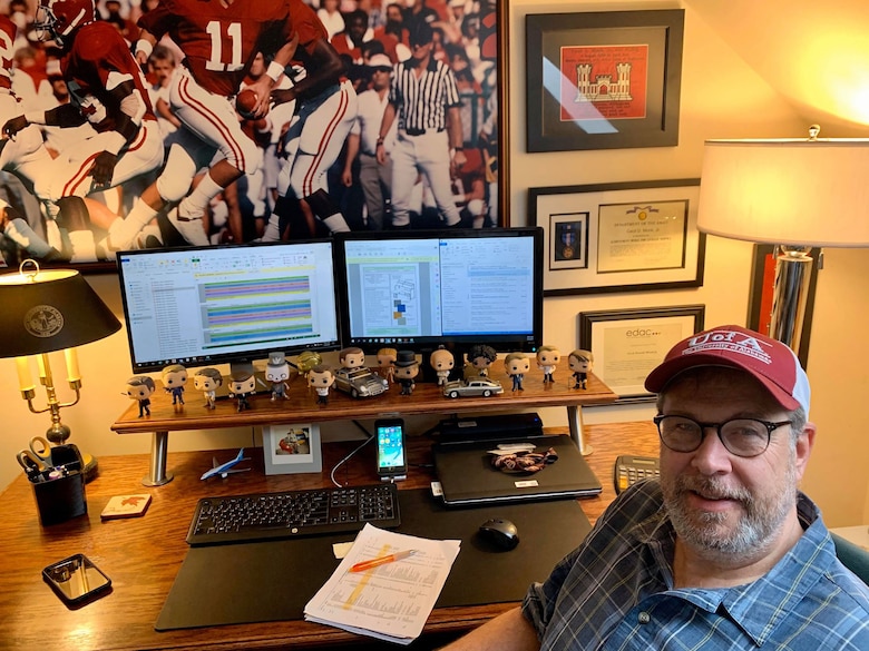 Don Monk, a project management specialist with Huntsville Center's Medical Outfitting and Transition Division, delivers the program from his home office in Birmingham, Ala. Monk has been teleworking regularly for years and has a set routine.