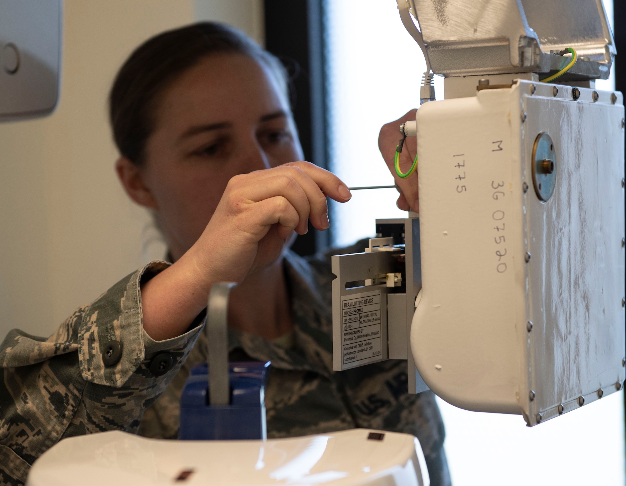 U.S. Air Force Staff Sgt. Heather Merrill, 52nd Medical Group biomedical equipment technician, checks a dental x-ray machine at Spangdahlem Air Base, Germany, April 1, 2020. Ensuring that medical equipment works is essential to proper patient care. (U.S. Air Force photo by Senior Airman Melody W. Howley)