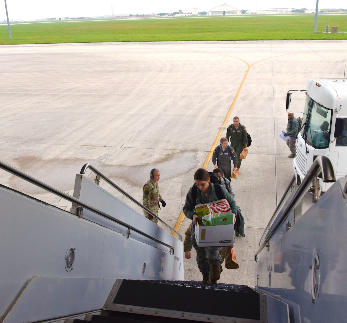 Medical technicians in the 433rd Airlift Wing mobilize and depart Joint Base San Antonio-Lackland, Texas, to respond to the COVID-19 crisis April 5, 2020.