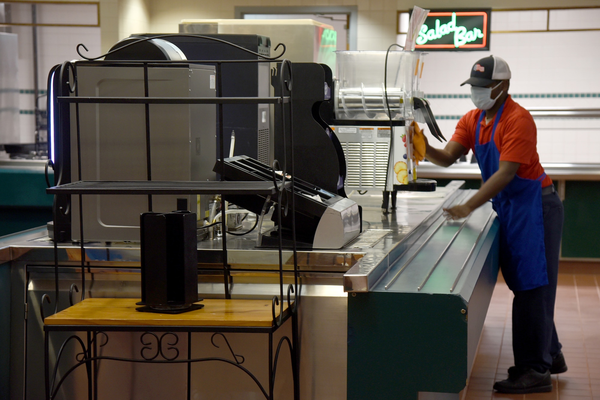 Daniel James, a food service worker at the Vanwey Dining Facility, cleans and sanitizes all machinery and countertops in the facility. The DFAC reopened April 5 after extensive renovations.