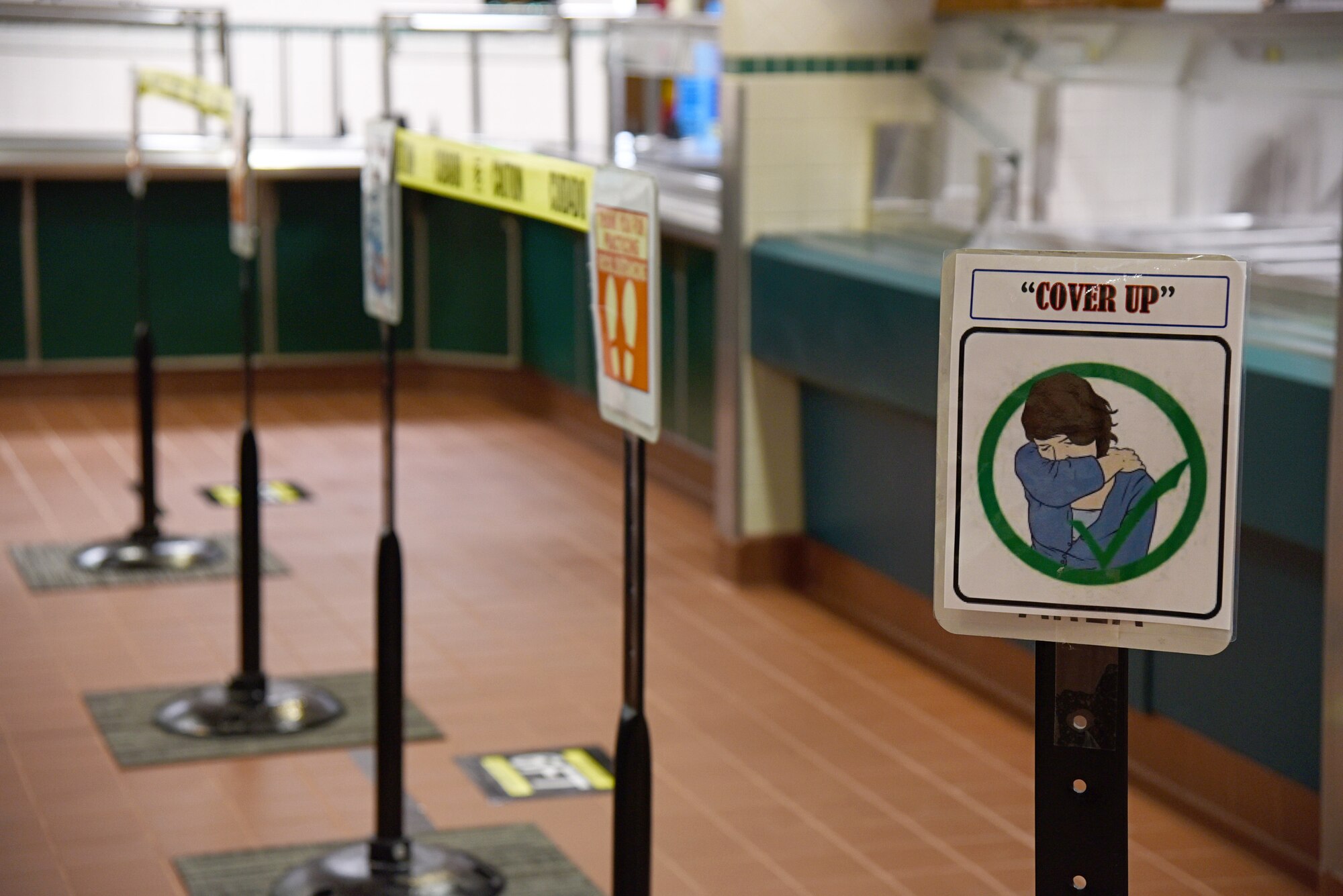 Signage inside the Vanwey Dining Facility to promote good hygiene and social distancing.