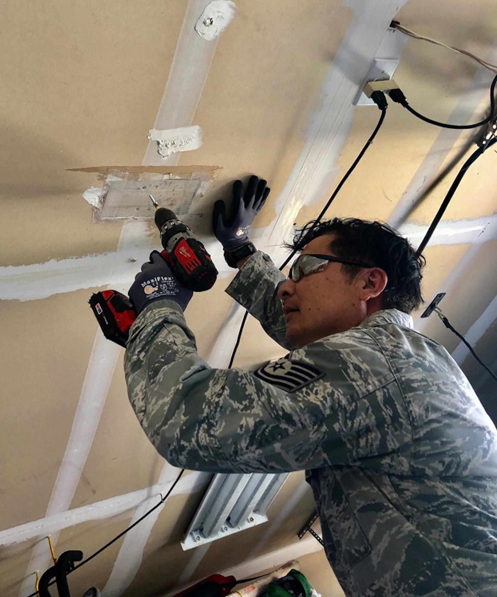 A photo of U.S. Air Force Tech. Sgt. Victor Reinares, a 624th Civil Engineer Squadron structural craftsman, conducting hands-on preplanned component of his training from home in Hawaii as part of the 624th Regional Support Group virtual unit training assembly April 4, 2020. Air Force Reserve Airmen in Hawaii and Guam continued mission readiness training during the first-ever 624th RSG virtual UTA, which was implemented to help keep Airmen safe during COVID-19 pandemic. (Courtesy Photo)