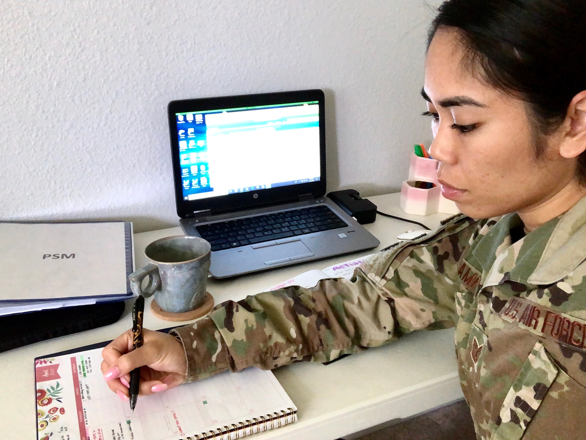 A photo of U.S. Air Force Teck. Sgt. Raena Campos, a Personnel Systems Management with the 624th Regional Support Group  Force Support Flight, providing personnel assistance to members as part of the 624th Regional Support Group virtual unit training assembly April 4, 2020, from her home in Hawaii. Air Force Reserve Airmen in Hawaii and Guam continued mission readiness training during the first-ever 624th RSG virtual UTA, which was implemented to help keep Airmen safe during COVID-19 pandemic. (Courtesy Photo)