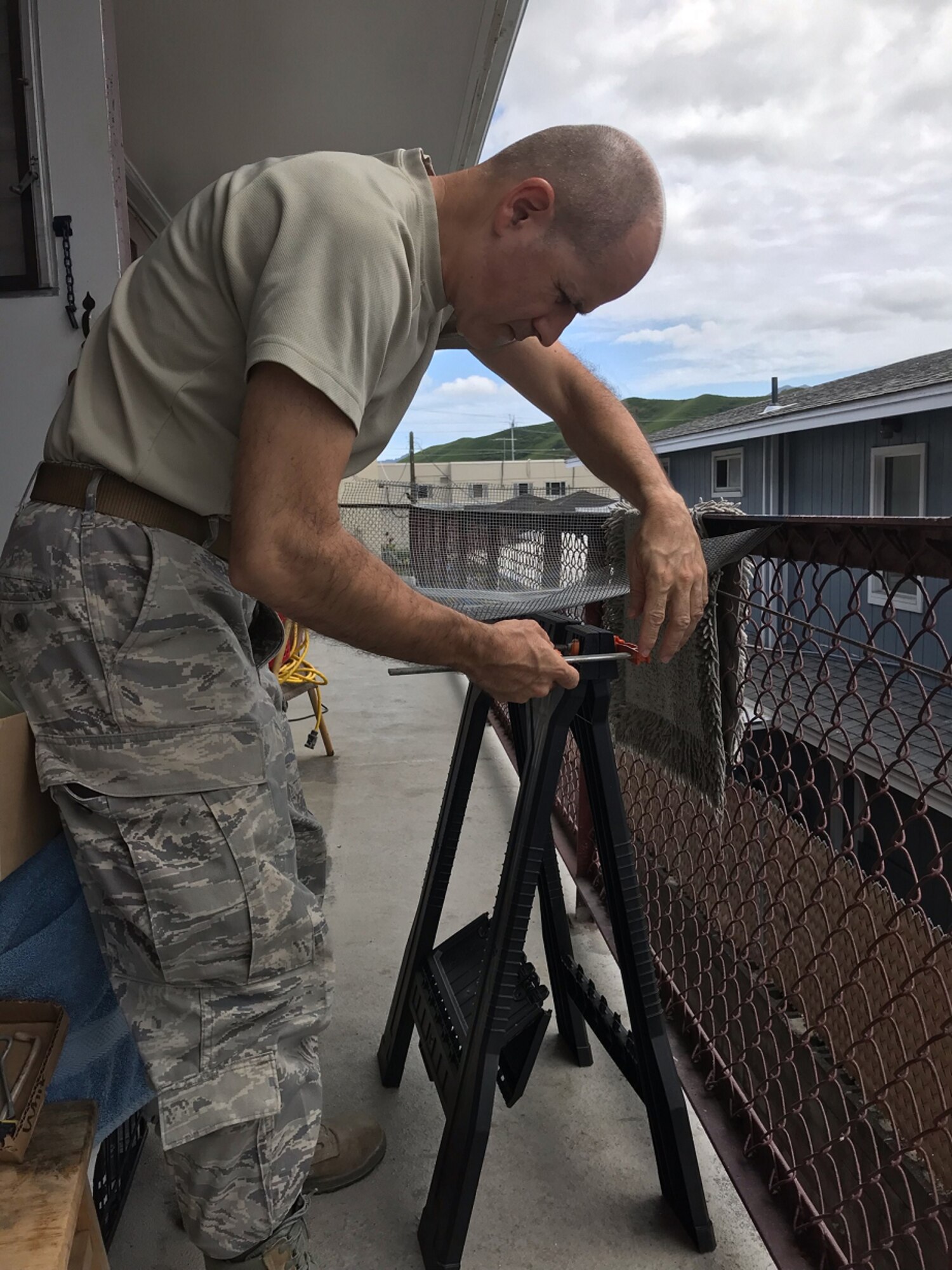 A photo of U.S. Air Force Tech. Sgt. TSgt Jeffery Baez, a 624th Civil Engineer Squadron structural craftsman, conducting hands-on preplanned component of his training from home in Hawaii as part of the 624th Regional Support Group virtual unit training assembly April 4, 2020. Air Force Reserve Airmen in Hawaii and Guam continued mission readiness training during the first-ever 624th RSG virtual UTA, which was implemented to help keep Airmen safe during COVID-19 pandemic. (Courtesy Photo)