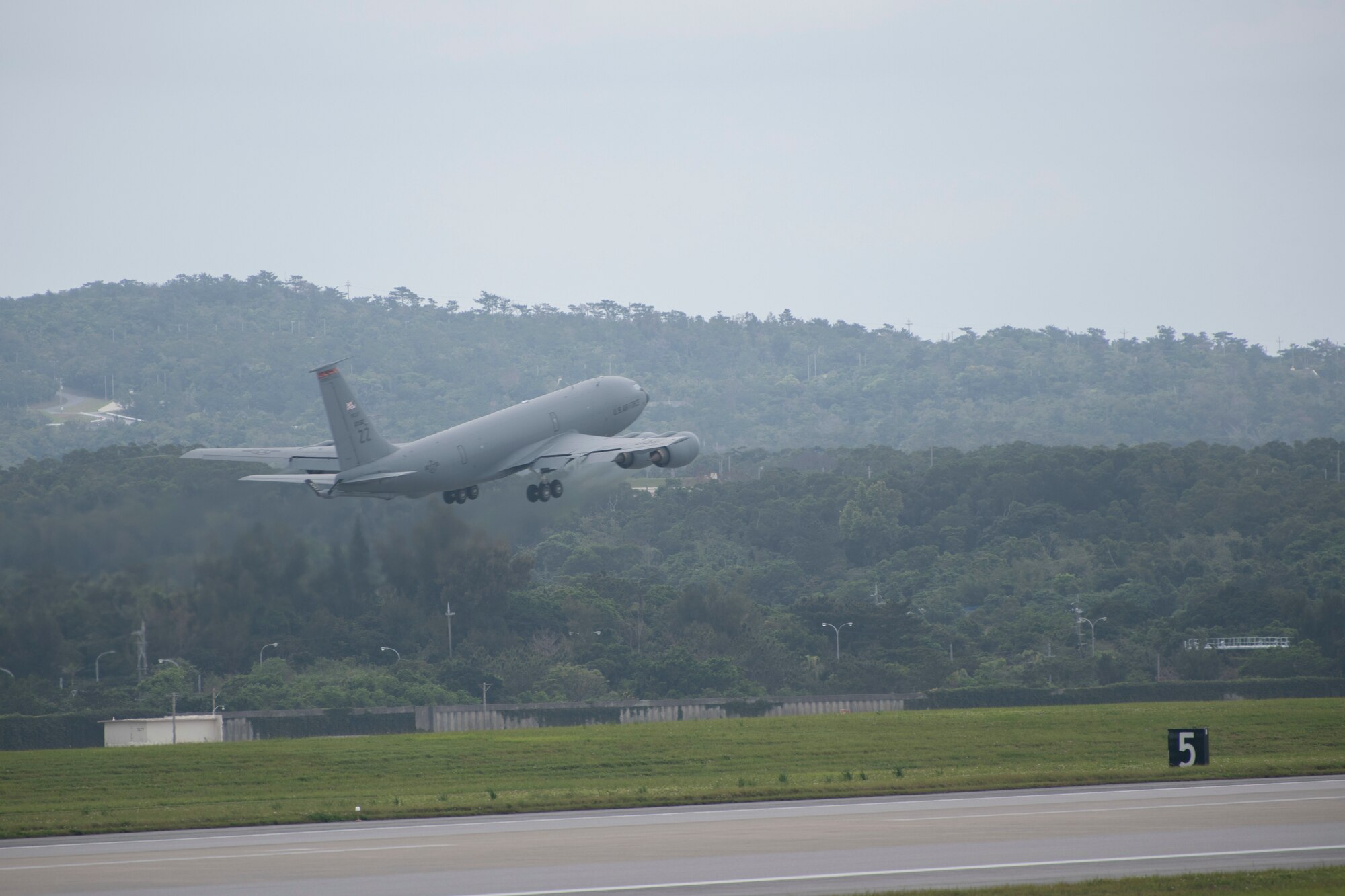 A U.S. Air Force KC-135 Stratotanker, assigned to the 909th Air Refueling Squadron, takes off April 6, 2020, at Kadena Air Base, Japan. Team Kadena is postured to protect its forces against COVID-19 while also maintaining mission readiness in support of the U.S.-Japan Alliance. The 909 ARS conducts aerial refueling missions throughout the region ensuring a free and open Indo-Pacific.  (U.S. Air Force photo by Senior Airman Rhett Isbell)