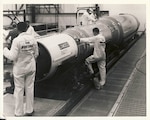 Boeing Company contractors assembling a missile.