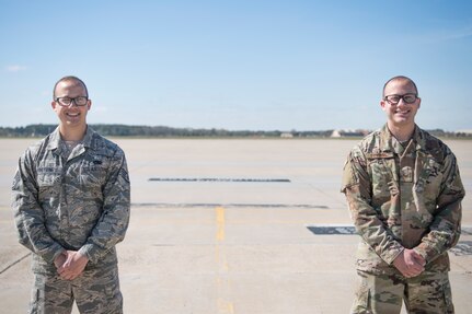 A portrait of identical twin Airmen standing side by side