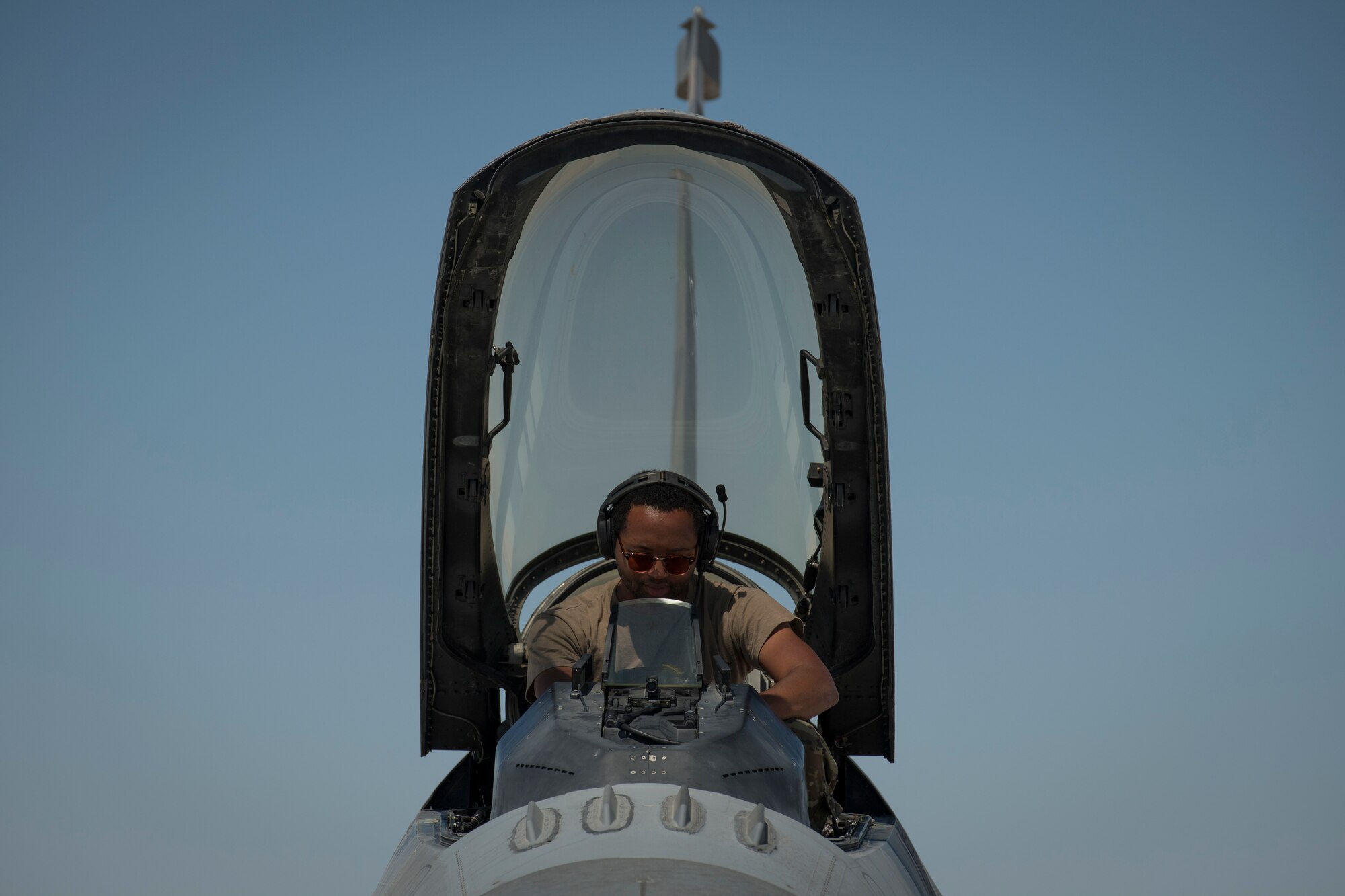A U.S. Air Force Airman with the 380th Expeditionary Aircraft Maintenance Squadron performs maintenance on the head-up display of a U.S. Air Force F-16 “Viper” Fighting Falcon at an undisclosed location in the U.S. Central Command area of responsibility, Feb. 23, 2020.