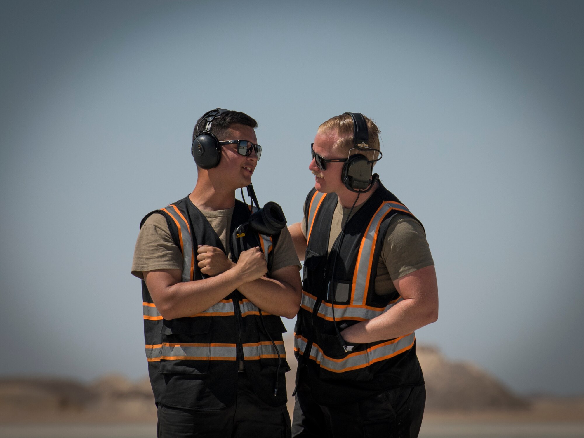 U.S Air Force Airman 1st Class Michael Tobat, left, and U.S Air Force Staff Sgt. David Williams, crew chiefs with the 380th Expeditionary Aircraft Maintenance Squadron, prepare to marshal a U.S. Air Force F-16 “Viper” Fighting Falcon assigned to the 79th Expeditionary Fighter Squadron at an undisclosed location in the U.S. Central Command area of responsibility, Feb. 24, 2020.