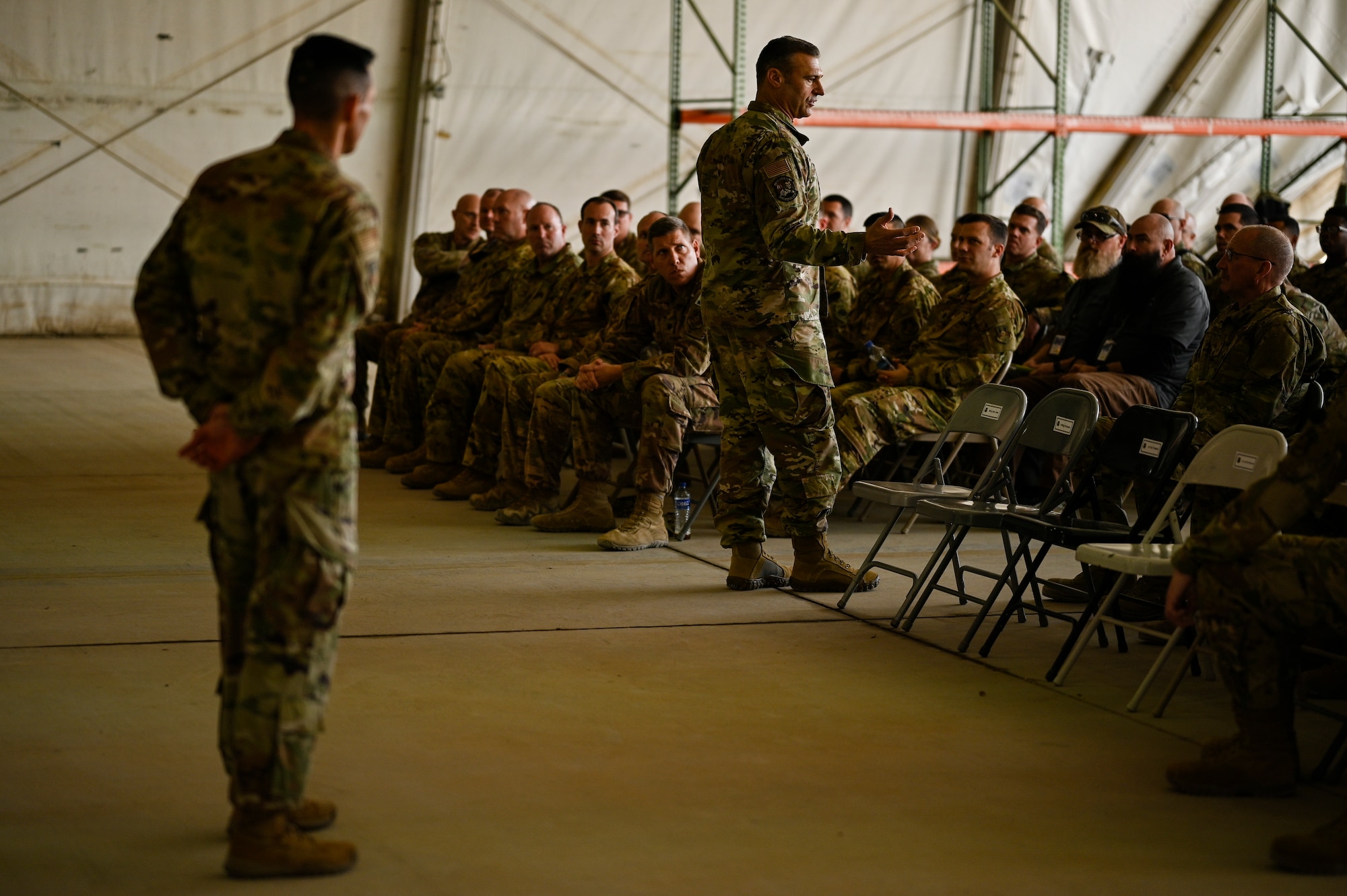 U.S. Air Force Lt. Gen. Joseph T. Guastella, Jr., Commander, U.S. Air Forces Central Command and Combined Forces Air Component Commander, and U.S. Air Force Chief Master Sgt. Shawn L. Drinkard, Command Chief Master Sgt. for USAFCENT, speak  with 451st Air Expeditionary Group Airmen at Kandahar Airfield about the importance of the USAFCENT mission in Afghanistan, Feb. 24, 2020.