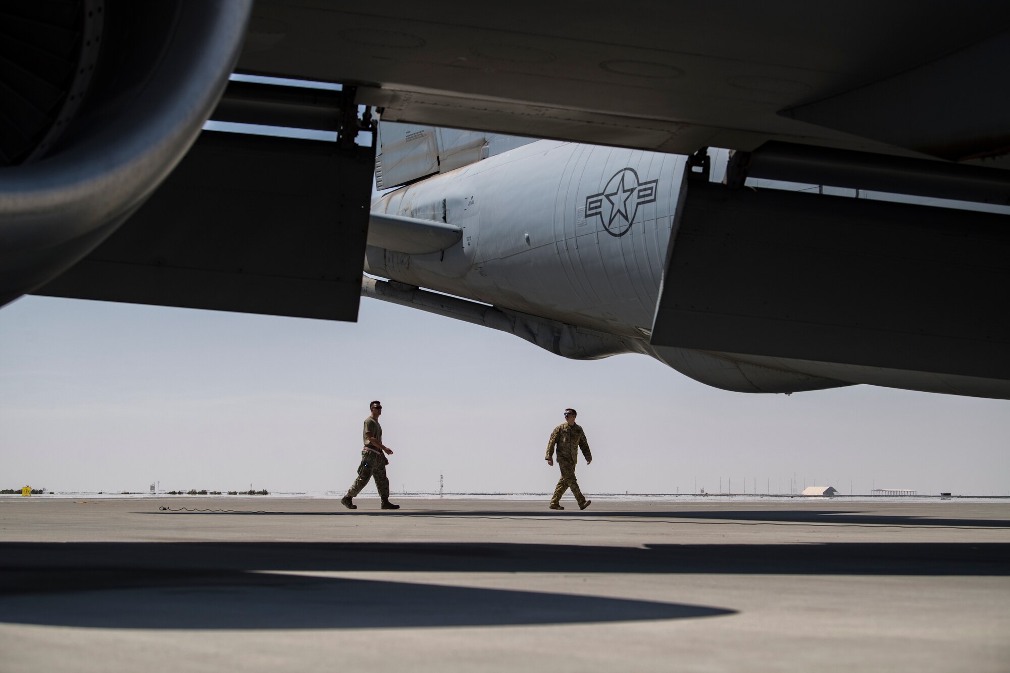 U.S. Air Force Airmen assigned to the 28th Expeditionary Air Refueling Squadron, perform a preflight check on a U.S. Air Force KC-135 Stratotanker at Al Udeid Air Base, Qatar, March 11, 2020.