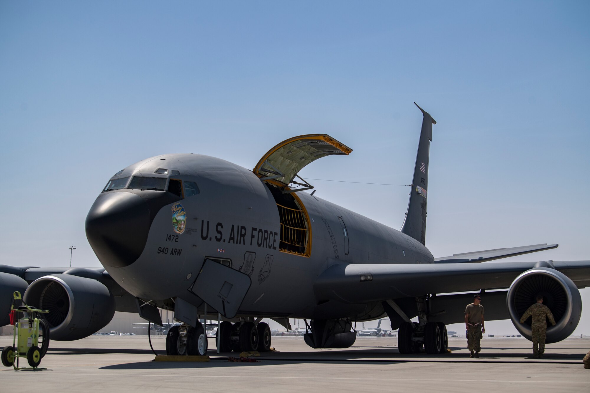 U.S. Air Force Airmen assigned to the 28th Expeditionary Air Refueling Squadron, perform a preflight check on a U.S. Air Force KC-135 Stratotanker at Al Udeid Air Base, Qatar, March 11, 2020.