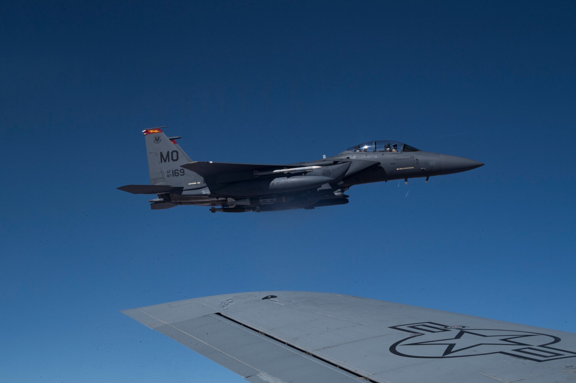 A U.S. Air Force F-15E Strike Eagle flies next to a U.S. Air Force KC-135 Stratotanker assigned to the 28th Expeditionary Air Refueling Squadron, over Iraq, March 11, 2020.