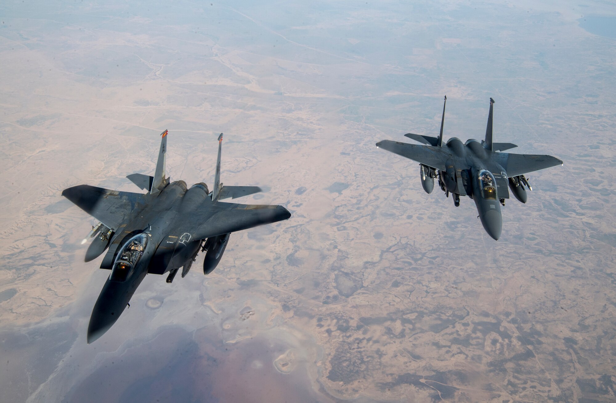 Two U.S. Air Force F-15E Strike Eagles fly over Iraq, March 11, 2020.