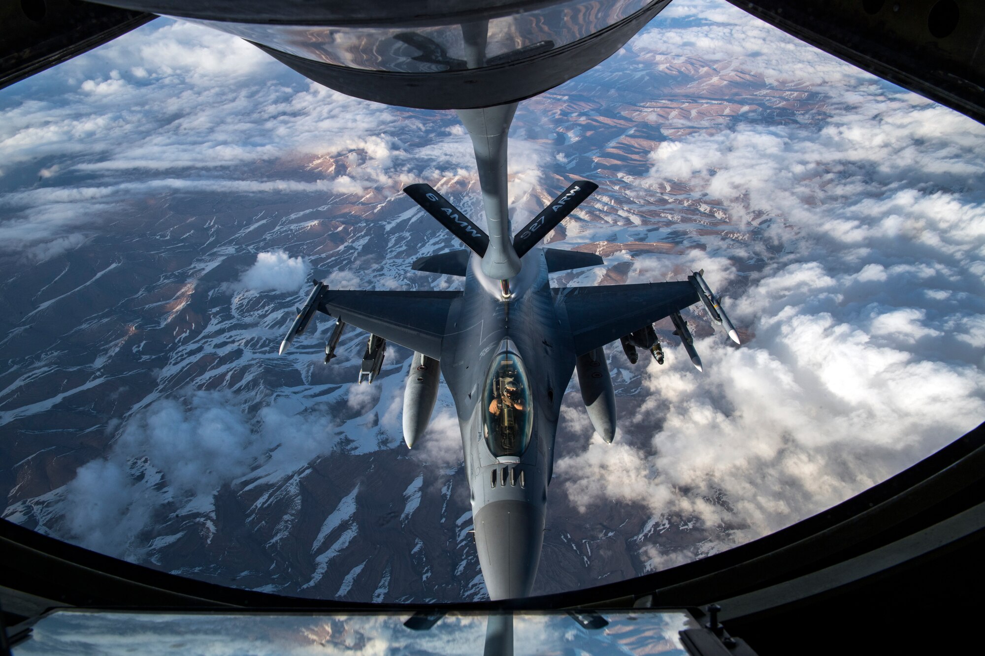 A U.S. Air Force F-16 Fighting Falcon receives fuel from a U.S. Air Force KC-135 Stratotanker assigned to the 28th Expeditionary Air Refueling Squadron over Afghanistan, March 17, 2020.