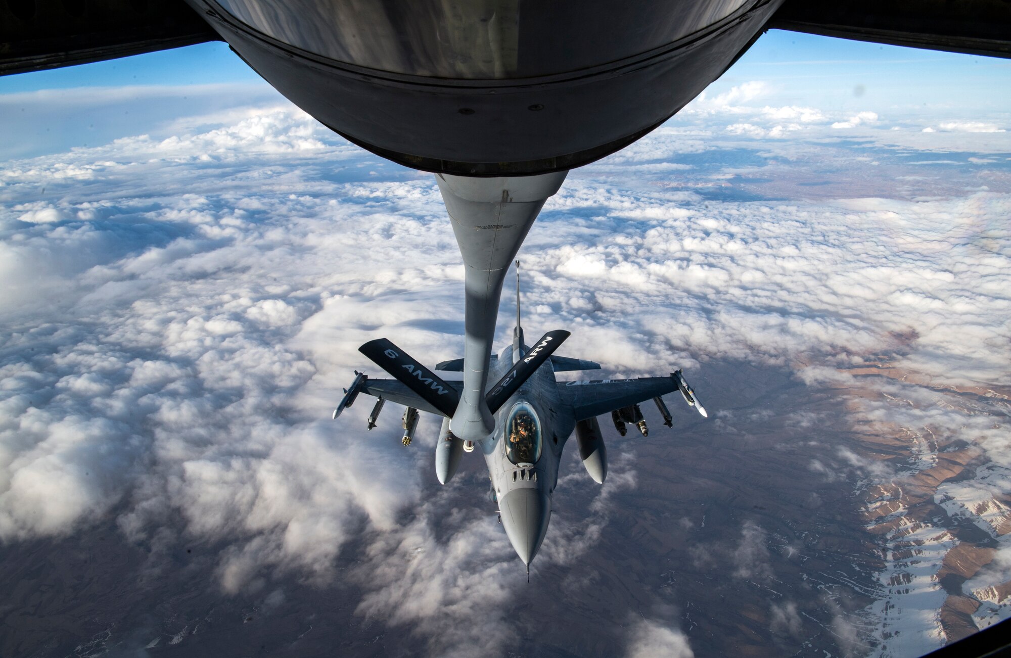 A U.S. Air Force F-16 Fighting Falcon approaches a U.S. Air Force KC-135 Stratotanker assigned to the 28th Expeditionary Air Refueling Squadron, to conduct an aerial refueling over Afghanistan, March 17, 2020.