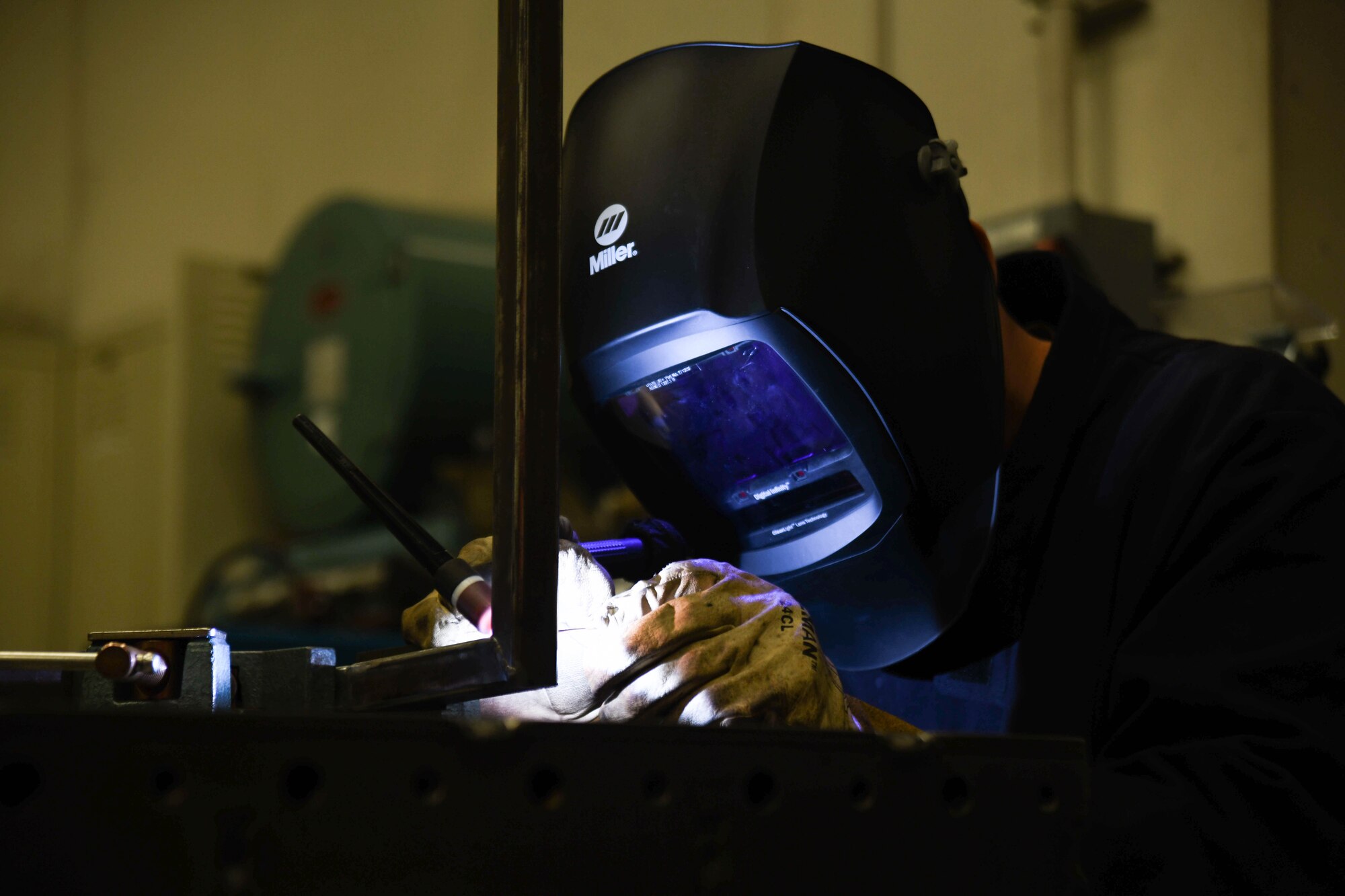 Staff Sgt. Derrick Wilkins, 22nd Maintenance Squadron aircraft metals technology craftsman, uses a Tungsten Inert Gas torch to weld a sewage grate cover March 24, 2020, at McConnell Air Force Base, Kansas. Metals technicians are responsible for welding, fabricating and machining metal aircraft components. (U.S. Air Force photo by Airman 1st Class Nilsa E. Garcia)