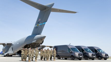 U.S. Marines render a final salute as the doors of the mortuary transfer vehicles are closed during Folded Flag 2017 April 11, 2017, on Dover Air Force Base, Del.