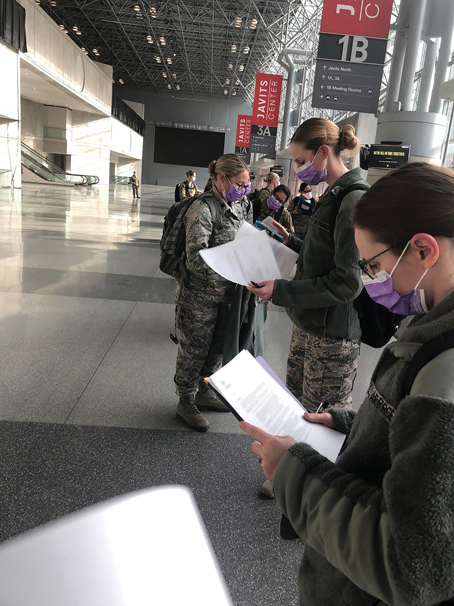 Seven Reserve Citizen Airmen from the 445th Aerospace Medicine and 445th Aeromedical Staging Squadrons in-process April 7, 2020 after deploying to Manhattan, New York City, where they are joining medical professionals from the civilian sector and all components of the armed services in response to COVID-19. The doctor, nurse practitioner and five nurses left Ohio April 5, 2020 and will be working in the Jacob K. Javits Center, a 2.1-million-square-foot convention center converted into a makeshift hospital in Manhattan, New York City. The 24-hour field hospital currently boasts 3,000 beds solely for individuals potentially exposed to, or confirmed ill with, COVID-19.