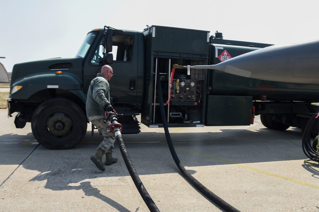 U.S. Air Force Tech. Sgt. Kevin Neiferd, 8th Logistics Readiness Squadron fuels distribution NCO in charge, puts away a hose after refueling an F-16 Fighting Falcon aircraft at Kunsan Air Base, Republic of Korea, April 3, 2020. The 8th LRS fuels management flight’s mission is to verify the quality of all fuel that comes in and out of the base to ensure the 8th Fighter Wing is always mission ready. (U.S. Air Force photo by Senior Airman Jessica Blair)