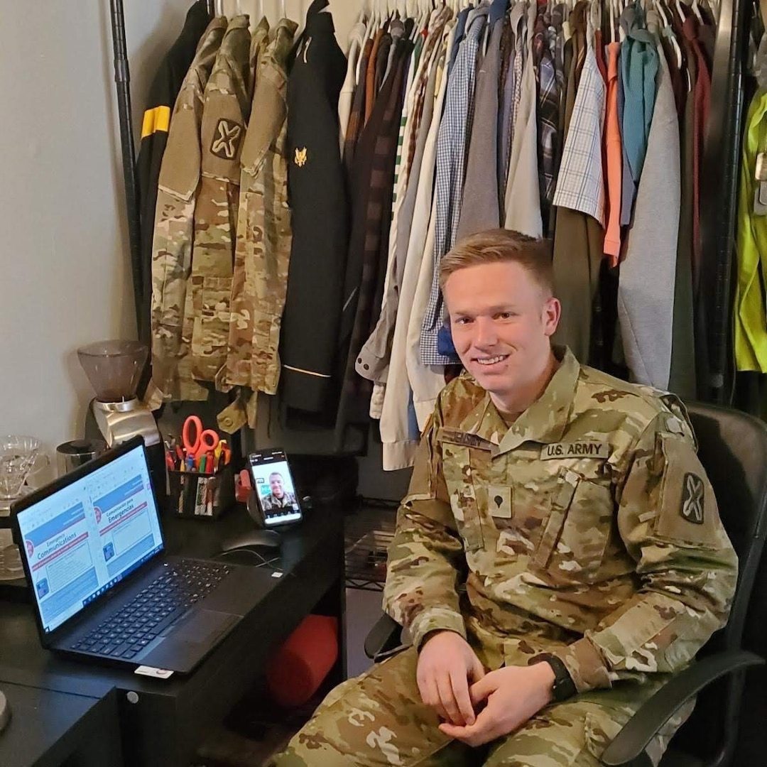 Spc. Logan Jensen, a Spanish and Chinese linguist with the 142nd Military Intelligence Battalion, 300th MI Brigade, Utah National Guard, collaborates over video teleconference with 2nd Lt. Joseph Kline, a Spanish linguist with the 141st Military Intelligence Battalion, to translate emergency preparedness information from English into Spanish during a statewide self-quarantine, near Salt Lake City, Utah, March 26, 2020.