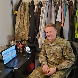 Spc. Logan Jensen, a Spanish and Chinese linguist with the 142nd Military Intelligence Battalion, 300th MI Brigade, Utah National Guard, collaborates over video teleconference with 2nd Lt. Joseph Kline, a Spanish linguist with the 141st Military Intelligence Battalion, to translate emergency preparedness information from English into Spanish during a statewide self-quarantine, near Salt Lake City, Utah, March 26, 2020.