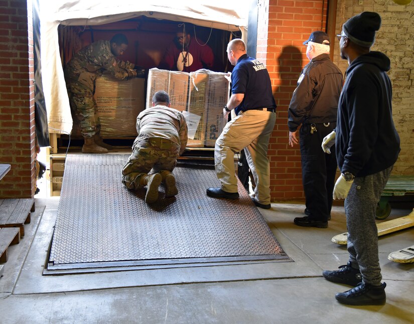 Pennsylvania National Guard members from 1/104th Cavalry -- part of Pennsylvania Task Force South -- load a LMTV with special needs cots at the Norristown State Hospital facility on Friday, April 3. Soldiers from the 1/104th Cavalry delivered 125 special needs cots to the Federal Emergency Management Agency field hospital located at Temple University's Liacouras Center in north Philadelphia.  The facility will be used as a potential surge hospital for patient care in the event that city hospitals are overwhelmed treating patients amid the COVID-19 outbreak.