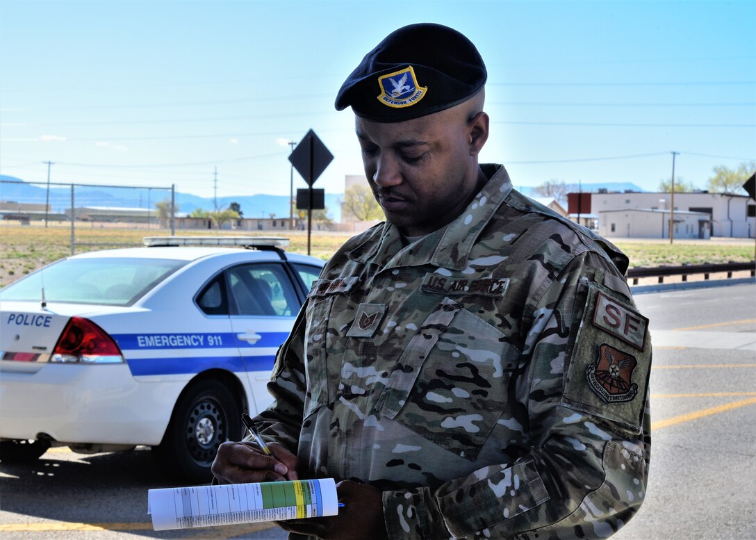 A team asks questions to a security forces member at the Truman Gate