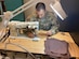 Tech. Sgt. Roman Contreras, quality assurance, air crew flight equipment, 412th Operations Support Squadron, 412th Operations Group, 412th Test Wing, fabricates a cloth mask using available equipment in the Air Crew Flight Equipment section at Edwards Air Force Base, April 7. Although cloth masks don’t offer full protection from COVID-19, the CDC advises that a simple cloth covering can slow the spread of the virus and help people who may have the virus and not know it from spreading it to others. (Courtesy photo)