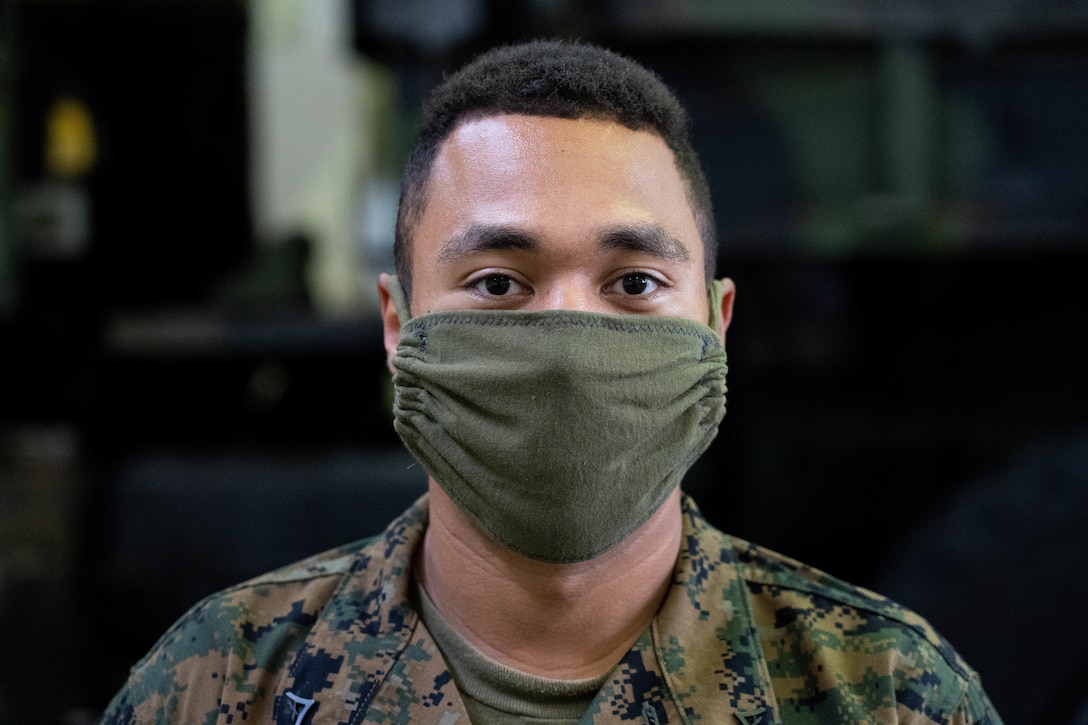 U.S. Marine Corps Lance Cpl. Michael Ottinger wears a homemade face covering while posing for a photo on Camp Foster, Okinawa, Japan, April 7, 2020. In line with the Centers for Disease Control and Prevention guidance, 3rd Marine Logistics Group Marines and Sailors are required to wear a face covering while outside their residence to stop the spread of Coronavirus 2019, stay healthy and remain ready for any mission anytime. Ottinger, a native of Atco, New Jersey, is a motor vehicle operator with Combat Logistics Battalion 4, Combat Logistics Regiment 3, 3rd MLG. (U.S. Marine Corps photo by Lance Cpl. David Esparza)