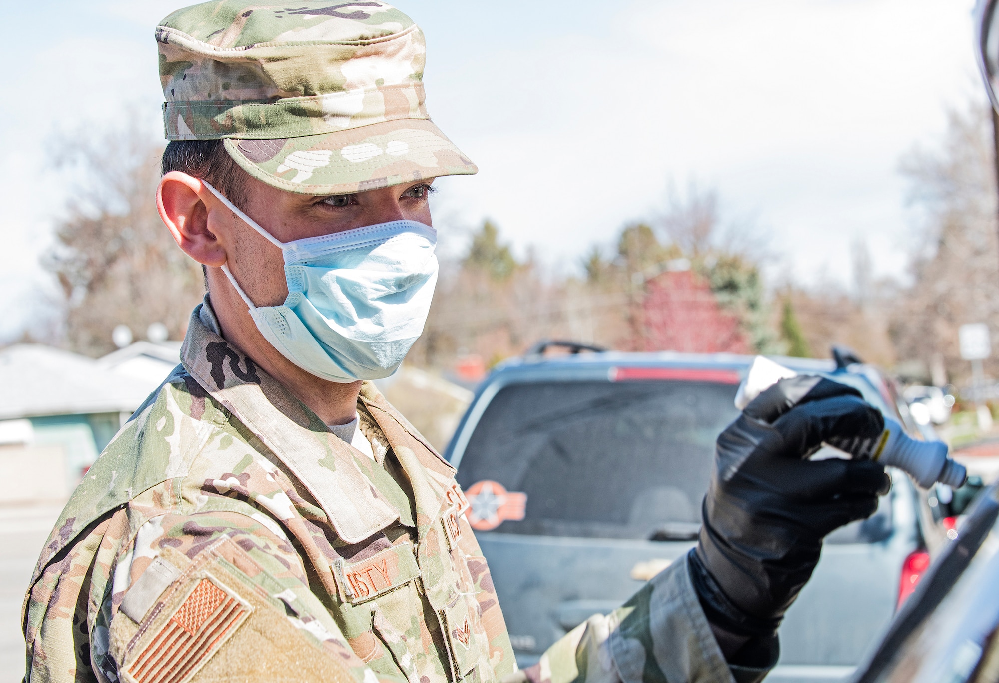 Senior Airman Nicholas Christy from the 124th Fighter Wing, Idaho National Guard, and the other Airmen are helping out at Idaho food banks by unloading food from trucks, sorting the food into carts and helping load the donated food into people's cars April 3, 2020.