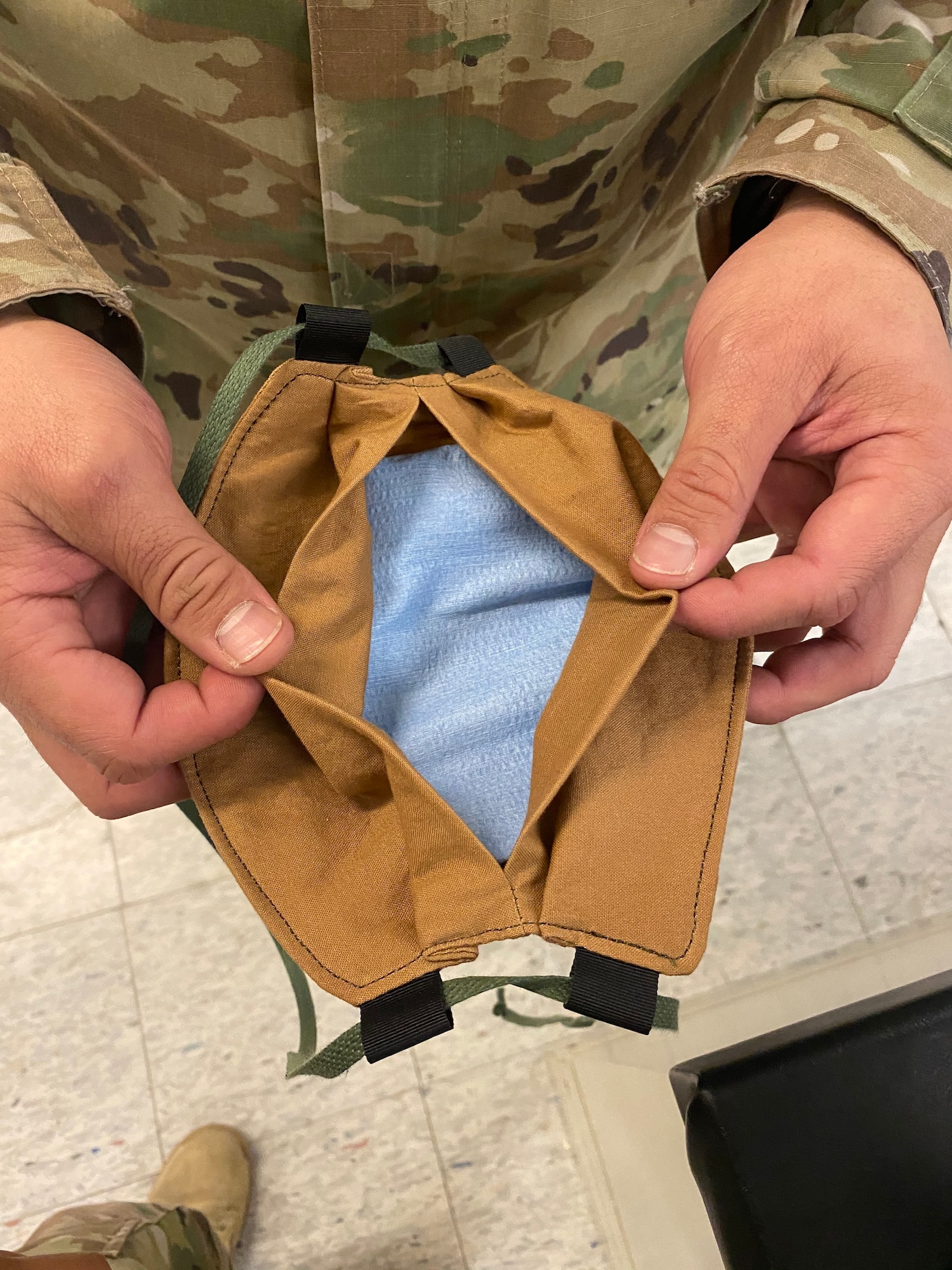 A cloth mask is fabricated by an Airmen with 412th Operations Support Squadron, 412th Operations Group, 412th Test Wing, using available equipment in the Air Crew Flight Equipment section at Edwards Air Force Base, April 7. Although cloth masks don’t offer full protection from COVID-19, the CDC advises that a simple cloth covering can slow the spread of the virus and help people who may have the virus and not know it from spreading it to others. (Courtesy photo)