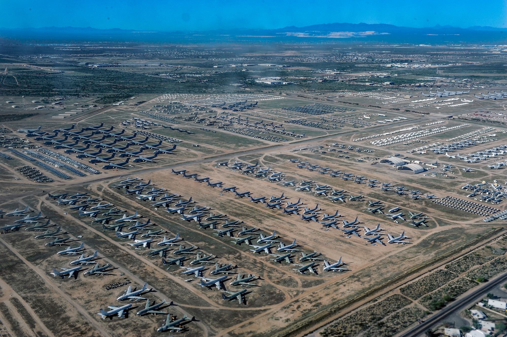 An aerial view of dozens of retired military aircraft in storage at the 309th Aerospace Maintenance and Regeneration Group, Davis-Monthan Air Force Base, Arizona.