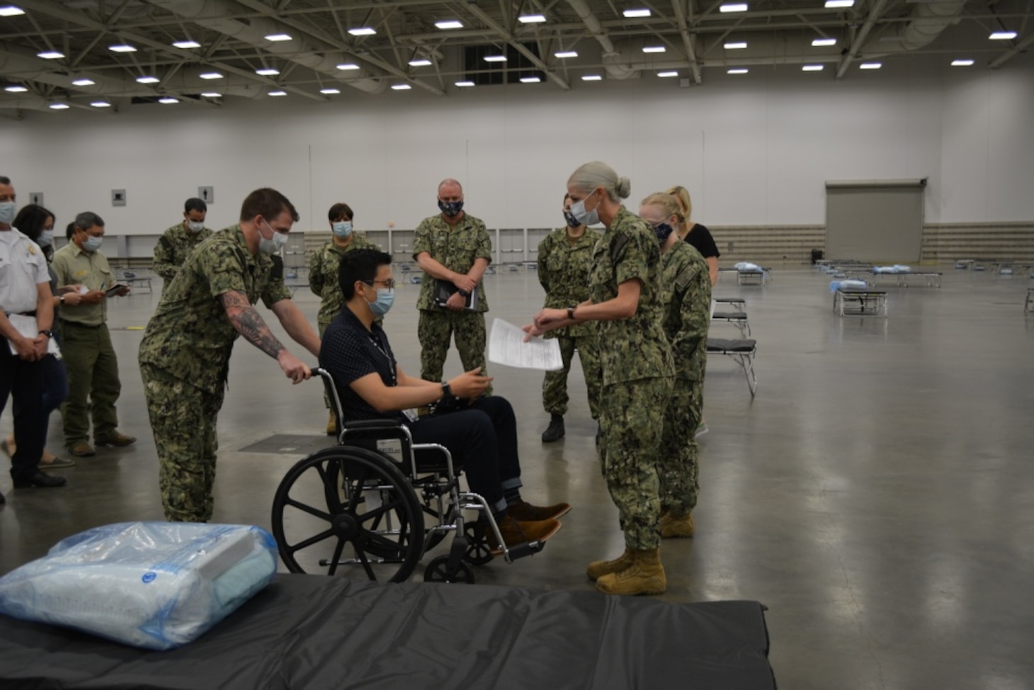 Sailors assigned to the Expeditionary Medical Facility-M, officials from the Federal Emergency Management Agency and the Department of Health and Human Services conduct a patient scenario exercise in Dallas, Texas in support of the Department of Defense COVID-19 response.