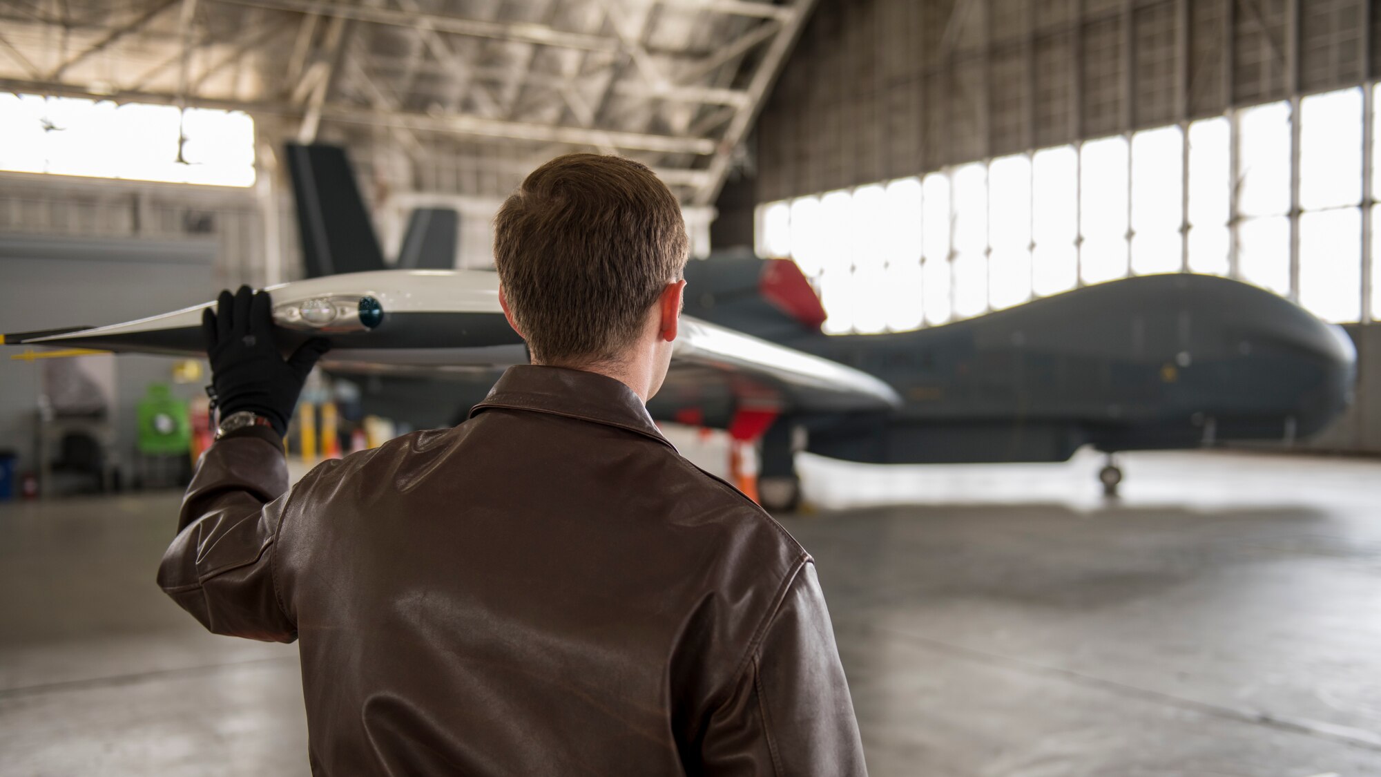 Maj. Marc Nichols, 452nd Flight Test Squadron Assistant Director of Operations, conducts a walk-through inspection of an RQ-4 Global Hawk remotely-piloted aircraft at Edwards Air Force Base, California, April 6. (Air Force photo by Giancarlo Casem)