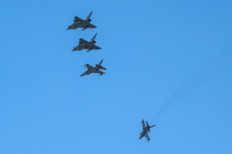 U.S. Fighting Falcons and German Eurofighter Typhoons fly in formation.