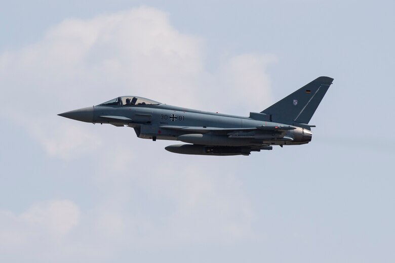 U.S. Fighting Falcons and German Eurofighter Typhoons fly in formation.