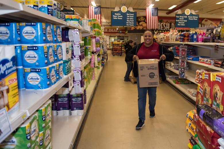 RAF Alconbury and RAF Molesworth employees and volunteers restock shelves at the base commissary at RAF Alconbury England, March 20, 2020. Volunteers answered the call to support the community to ensure service members and their families had access to essential items amid COVID-19. (U.S. Air Force photo by Airman 1st Class Jennifer Zima)