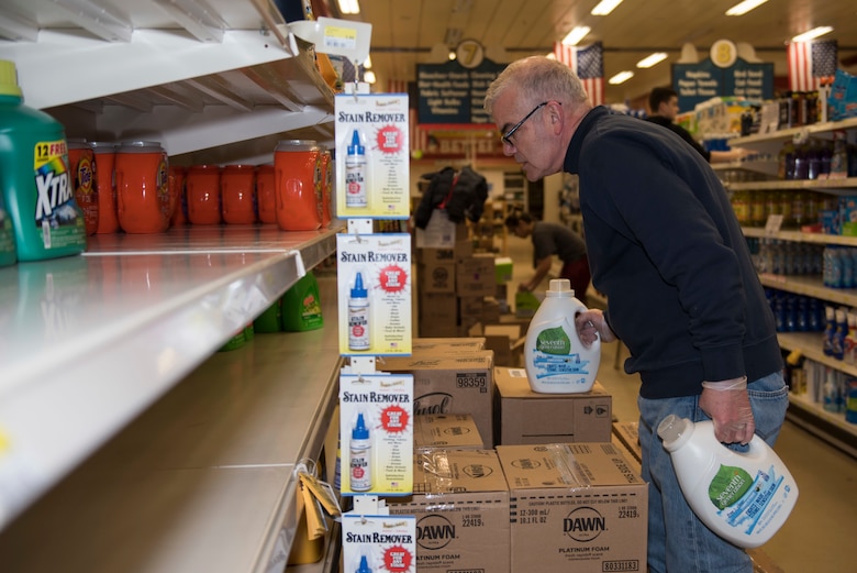 RAF Alconbury and RAF Molesworth employees and volunteers restock shelves at the base commissary at RAF Alconbury England, March 20, 2020. Volunteers answered the call to support the community to ensure service members and their families had access to essential items amid COVID-19. (U.S. Air Force photo by Airman 1st Class Jennifer Zima)