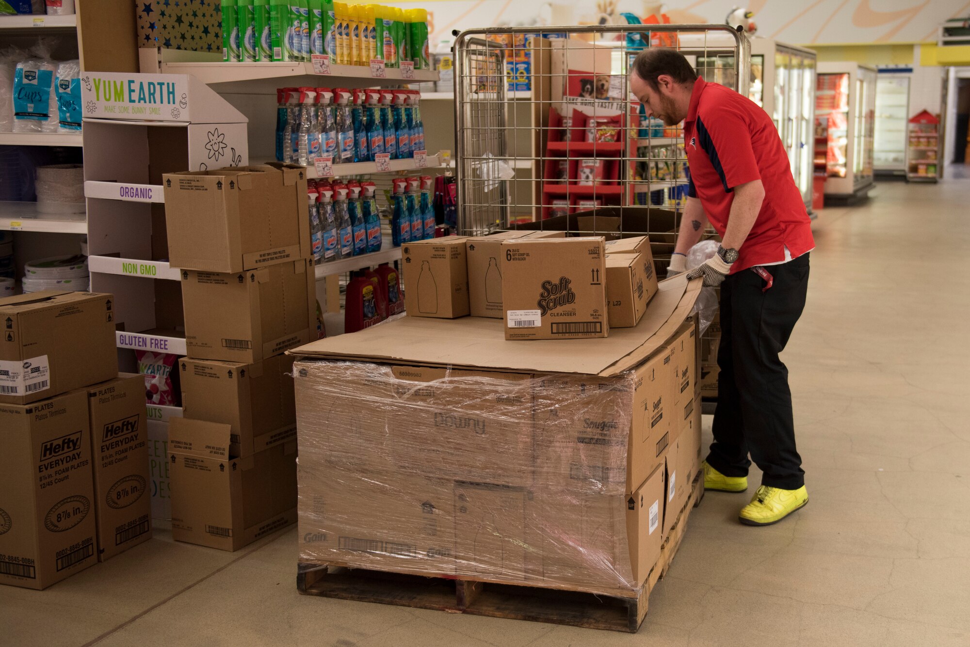 RAF Alconbury and RAF Molesworth employees and volunteers restock shelves at the base commissary at RAF Alconbury England, March 20, 2020. Volunteers answered the call to support the community to ensure service members and their families had access to essential items amid COVID-19. (U.S. Air Force photo by Airman 1st Class Jennifer Zima)