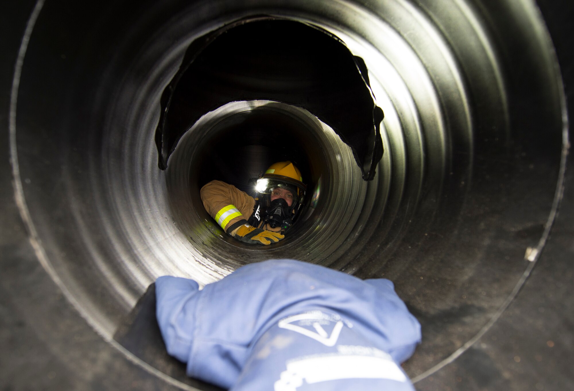 Firefighters with the 423rd Civil Engineer Squadron train on a confined spaces trainer at RAF Alconbury, England on March 30, 2020. This type of training helps the firefighters maintain readiness and stay proficient in their craft. (U.S. Air Force photo by Master Sgt. Brian Kimball)