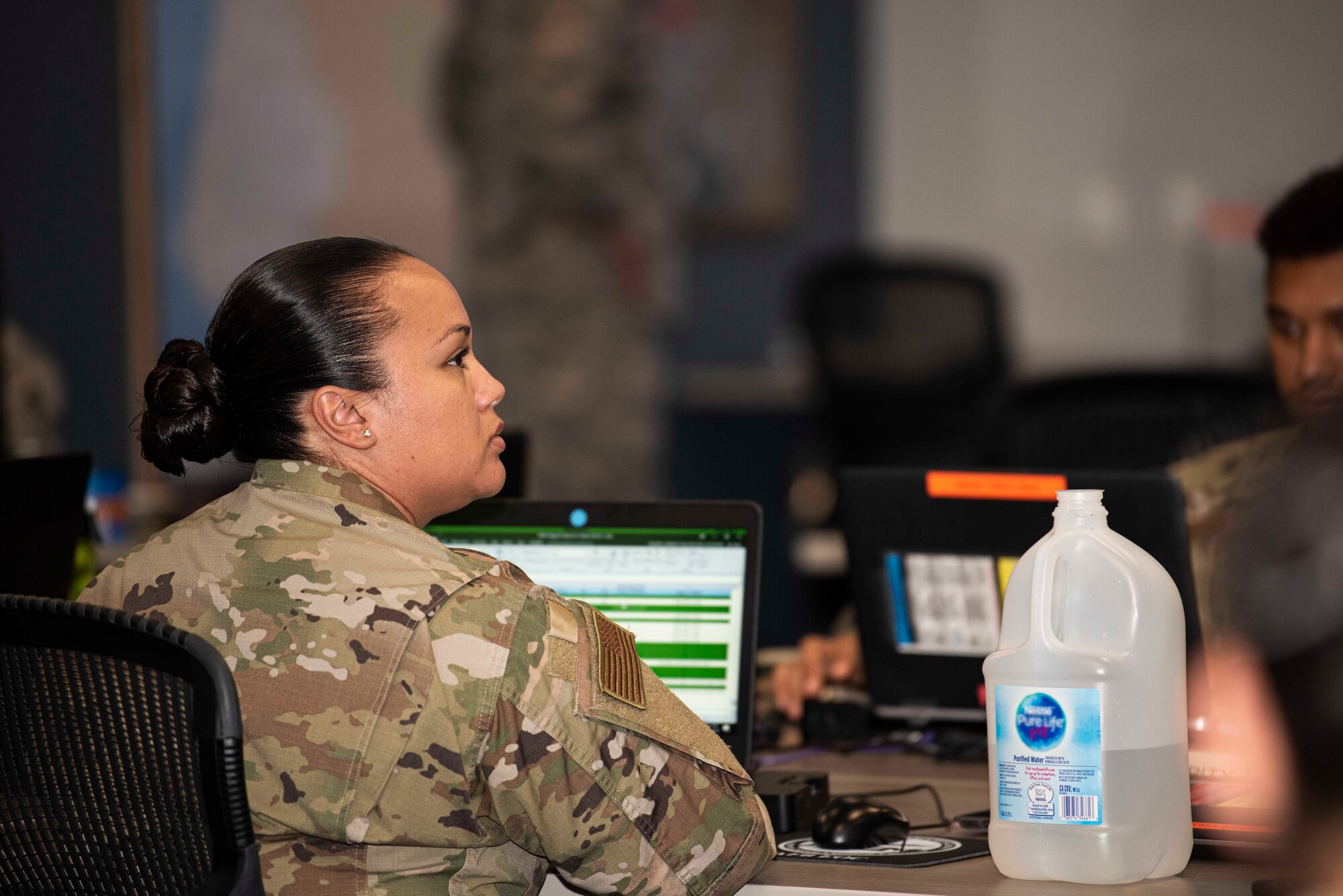 Tech. Sgt Genevie Navarro, 30th Security Forces Squadron launch operations support technician, participates during an Emergency Operation Center meeting March 31, 2020, at Vandenberg Air Force Base, Calif. The EOC hosted subject matter experts from different specialty across the base to brainstorm the best procedures to mitigate the spread of COVID-19. (U.S. Air Force photo by Airman 1st Class Hanah Abercrombie)