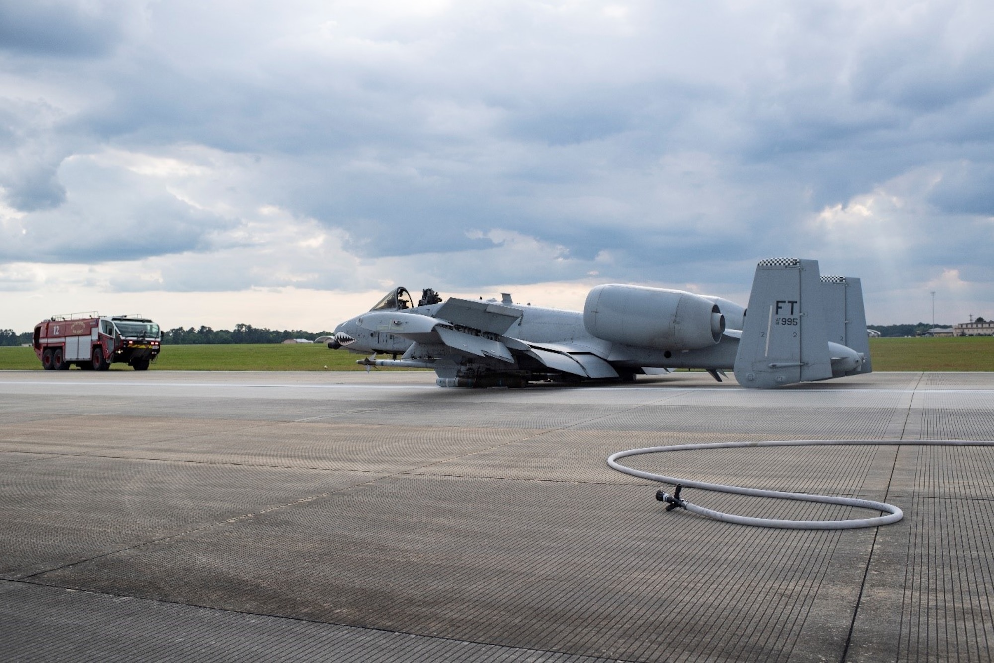 A photo of an A-10C Thunderbolt II aircraft sitting on the runway.