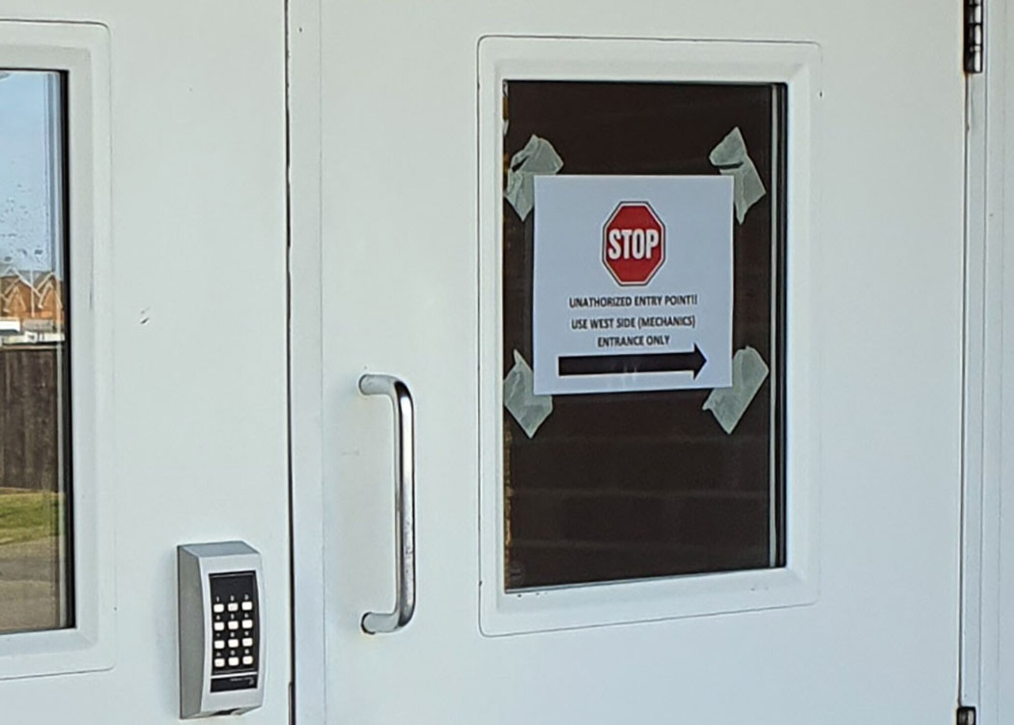 A sign on the front door of the 100th Civil Engineer Squadron Fire Department shows current restrictions and single point of entry as part of the extra precautions being taken by the fire department April 7, 2020, at RAF Mildenhall, England. During the COVID-19 lockdown, the fire department's leadership is regularly adjusting policy and providing firefighters crucial updates to ensure the health and safety of the fire station. (Courtesy photo by Matthew Thorpe)